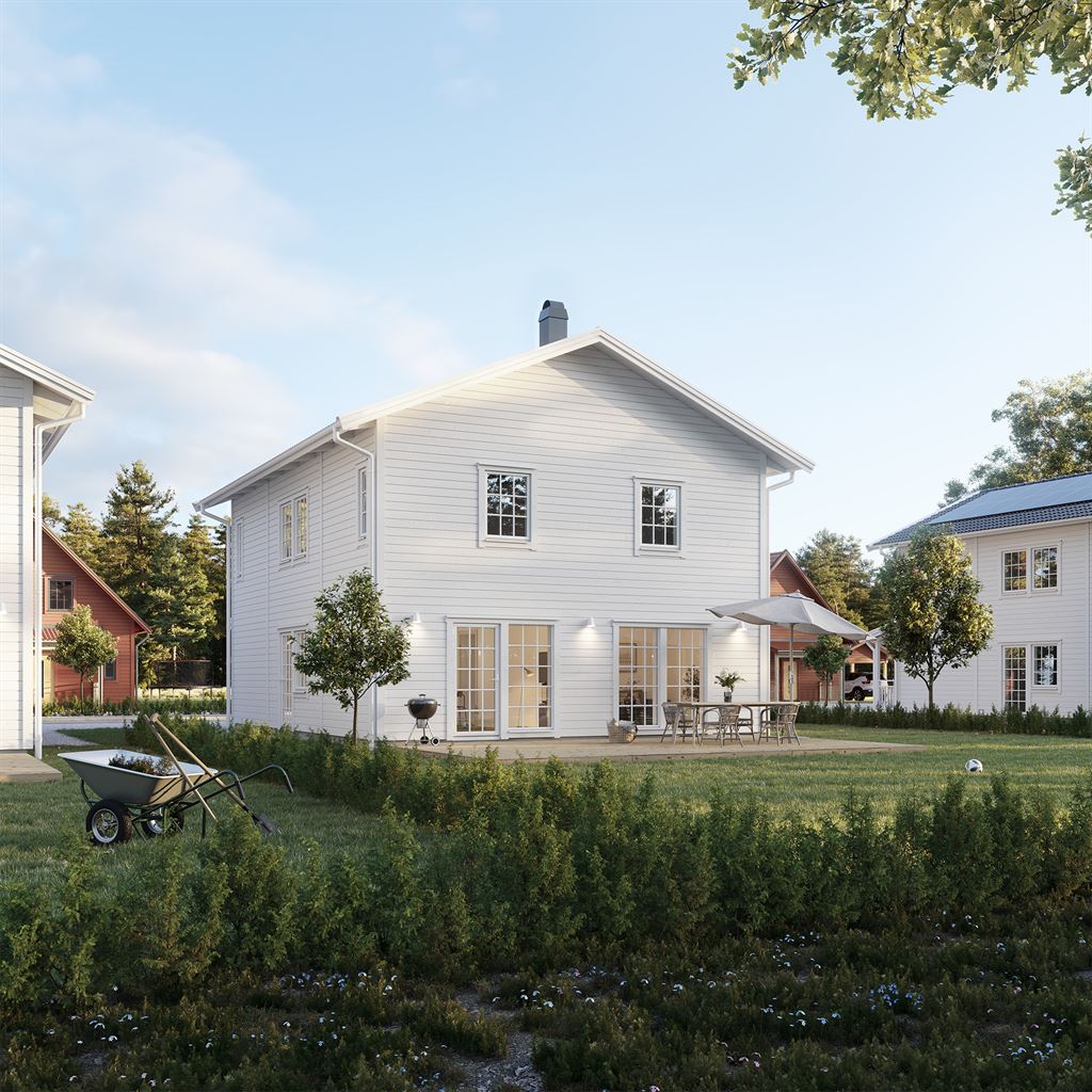 Vitt Villa Ekbacken klassiskt med spröjs och altan i bostadsområde